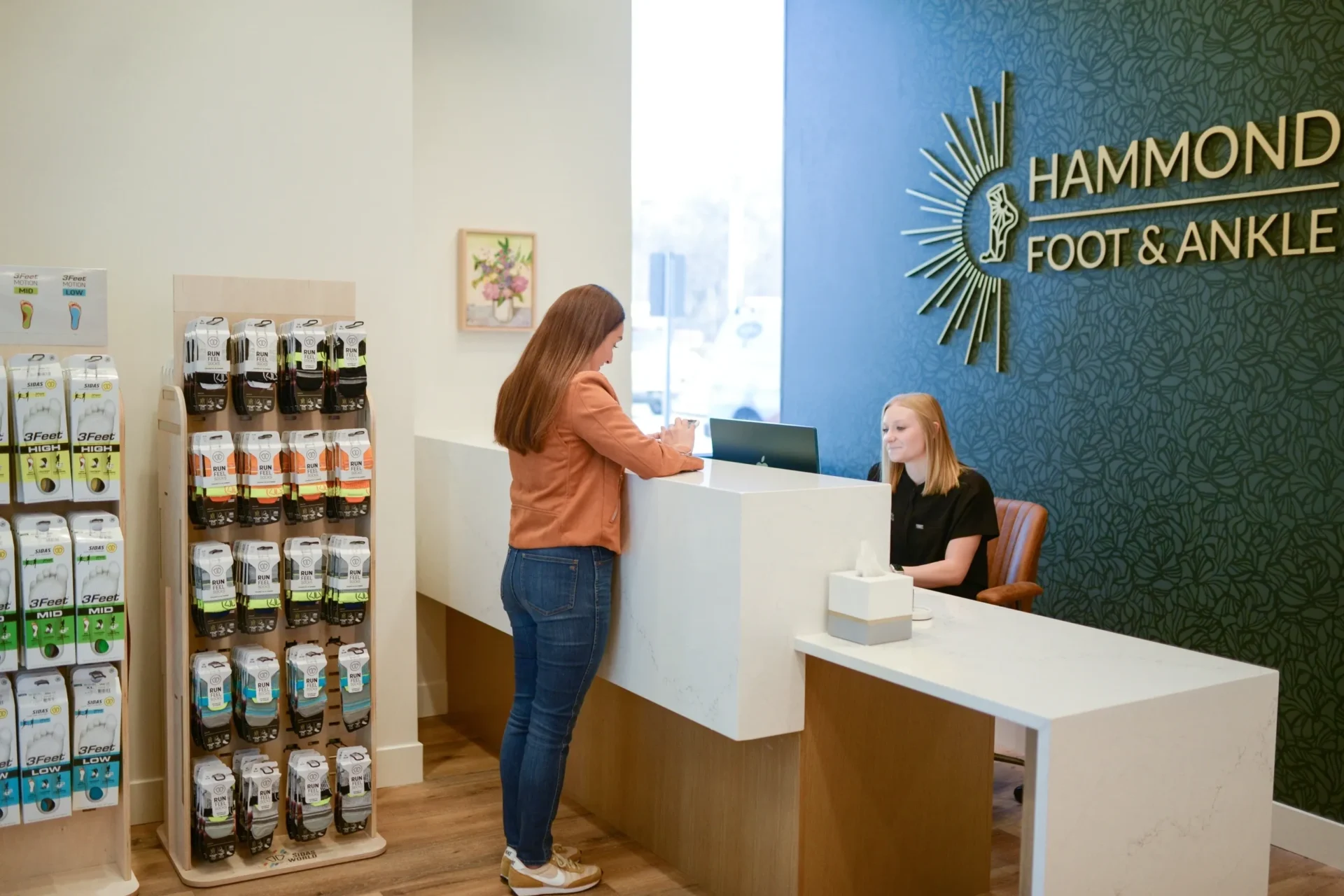 A woman standing at the counter of a store